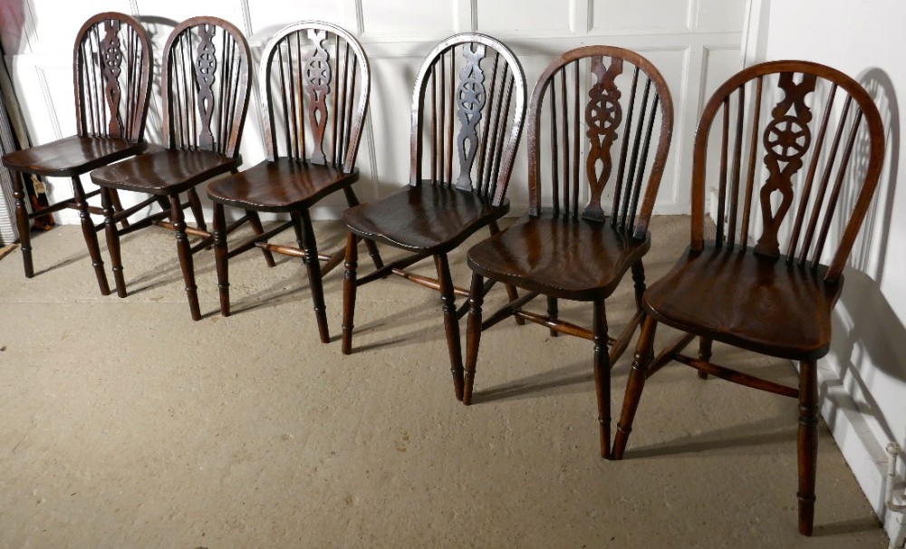 A Harlequin Set of 6 Victorian Beech & Elm Wheel Back Windsor Kitchen Dining Chairs