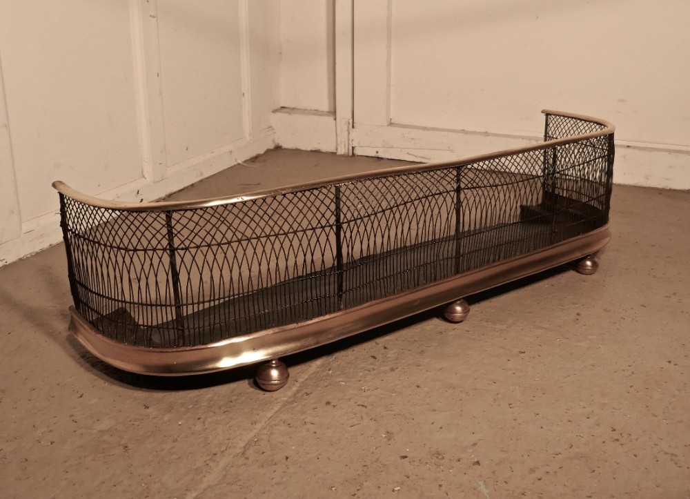 A Georgian Brass and Iron Club Fender or Nursery Fire Guard