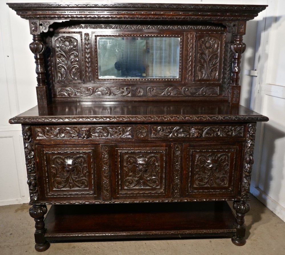 19th Century Carved Oak Mirror Back Dresser with Tree of Life and Green Man Carvings