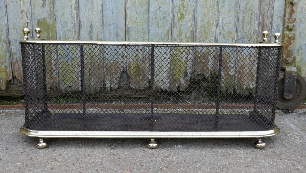 A Victorian Brass and Iron Club Fender