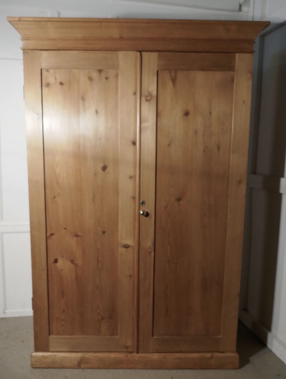 A Victorian Stripped Pine Wardrobe Compactum