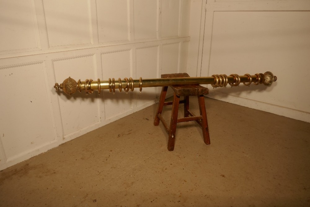 A very Chunky Victorian Brass Curtain Poles with Rings