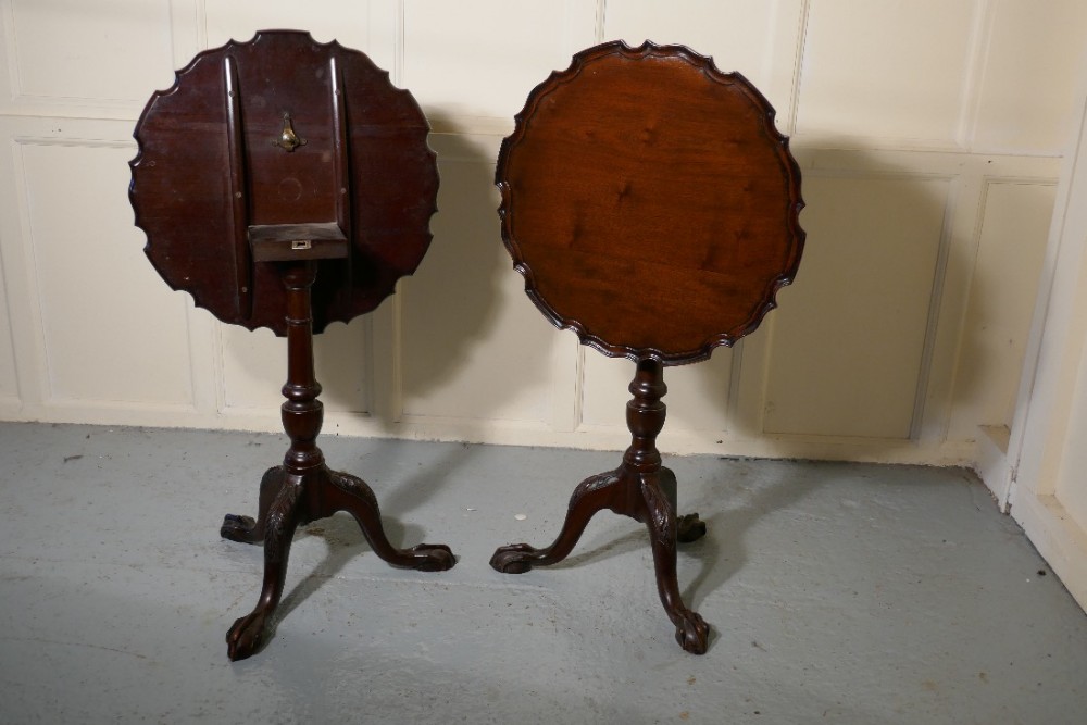 A Pair of Georgian Mahogany Tripod Wine Tables with a Pie Crust Edge