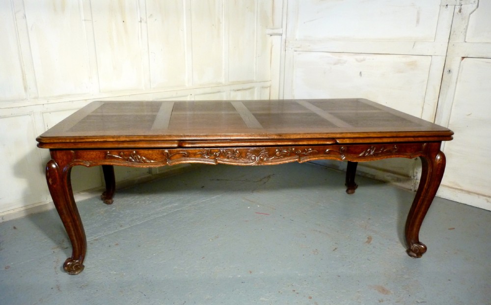 A Large French Oak Draw Leaf Table  View X