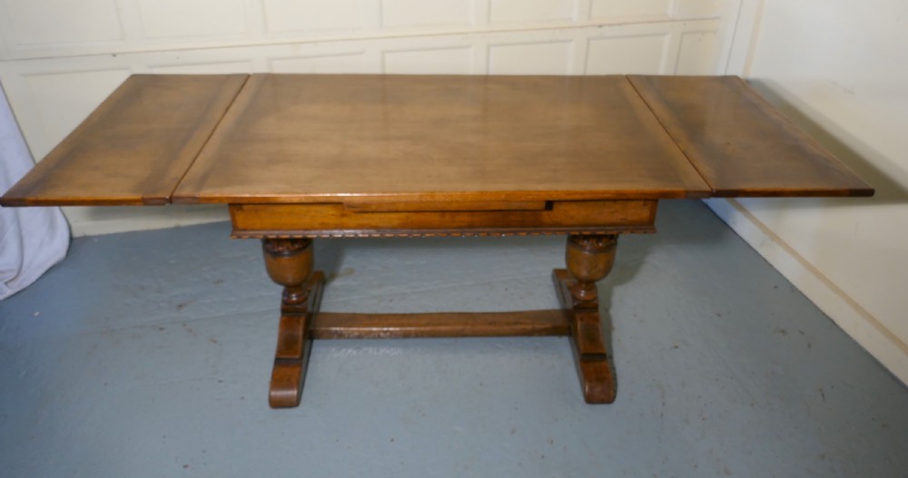 A Large Ipswich Oak Draw Leaf table View IX