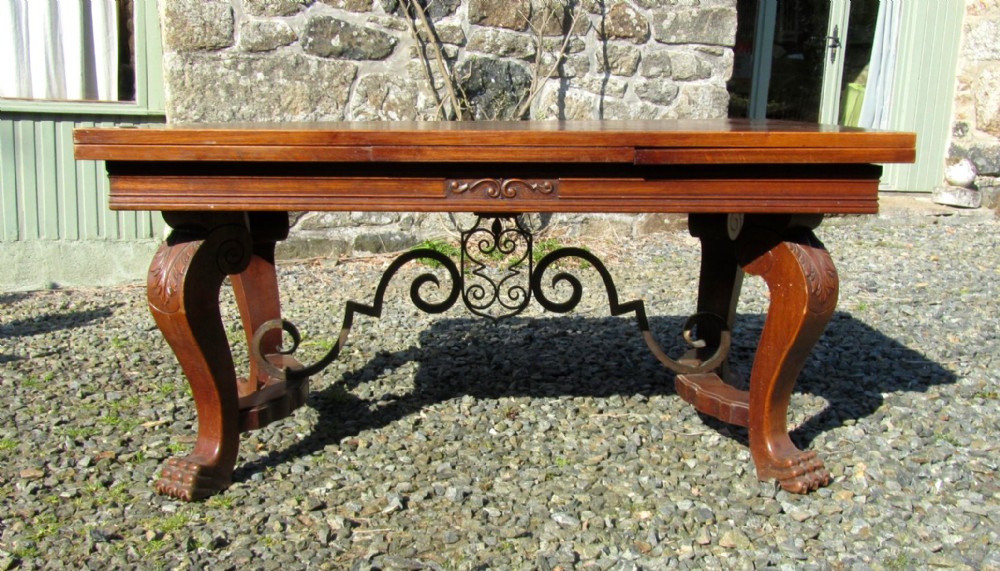 A Large 19th Century Carved and Parquetry Oak Draw Leaf table