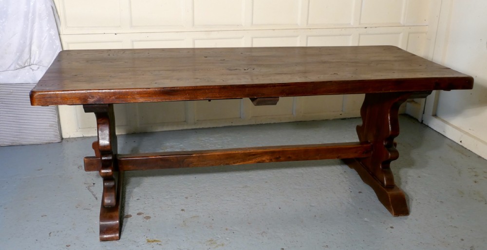 A Large French Elm Refectory Extending Table View IV