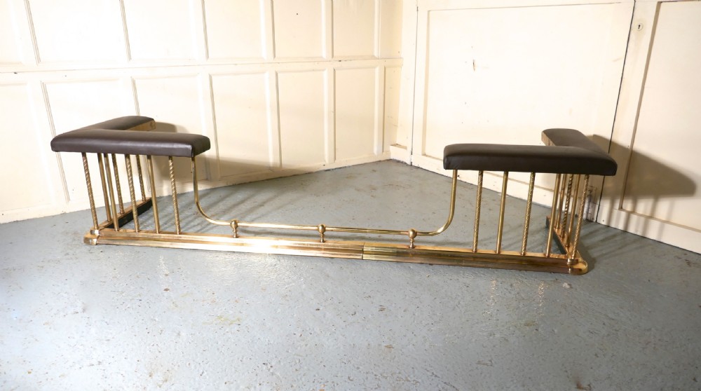 A Very Large Extending Brass and Leather Club Fender View III