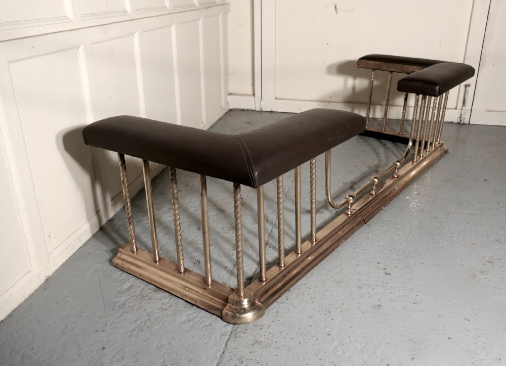 A Very Large Extending Brass and Leather Club Fender View VII
