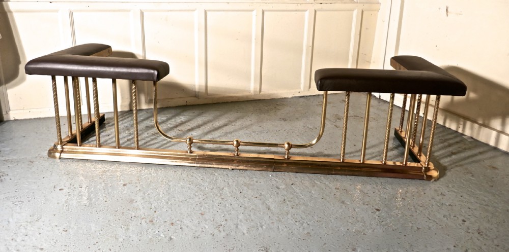 A Very Large Extending Brass and Leather Club Fender View IX