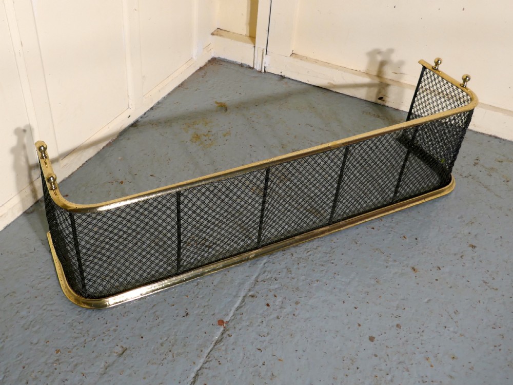 A Victorian Brass and Iron Club Fender View III