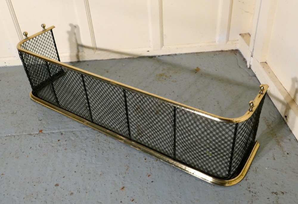A Victorian Brass and Iron Club Fender View IV