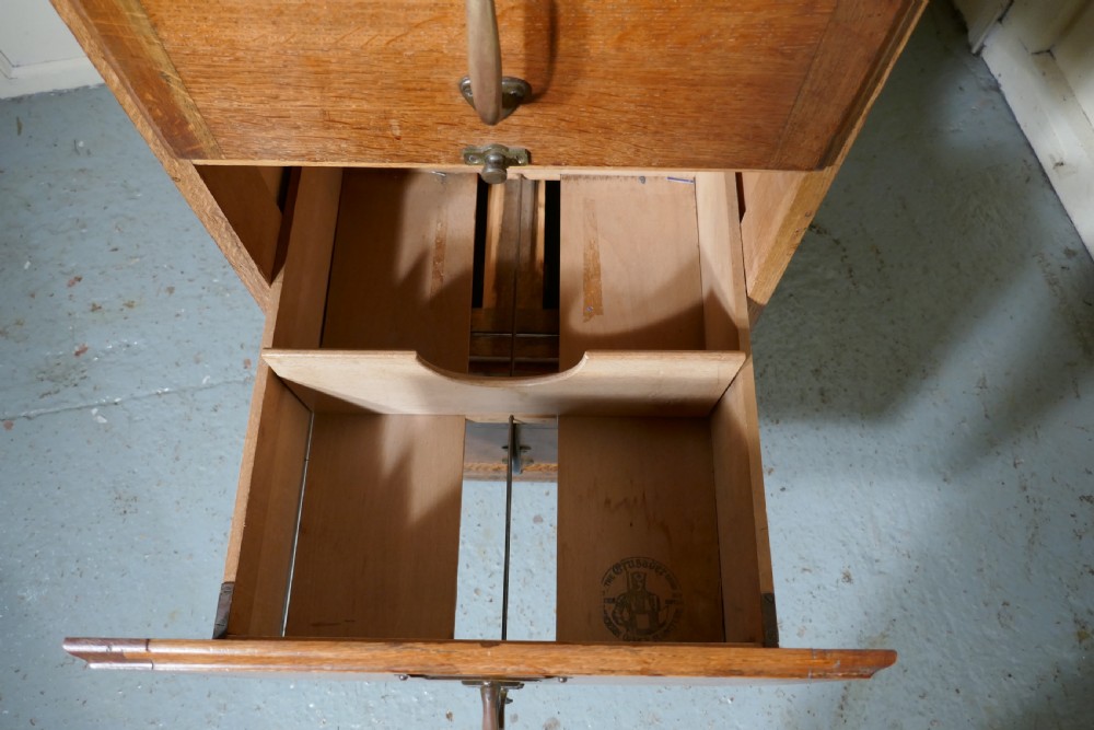 A Large Art Deco 4 Drawer Oak Filing Cabinet View VII