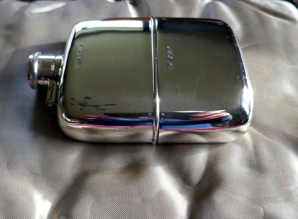 A Solid Silver Hall Marked Hip Flask and Cup by Daniel & Arter