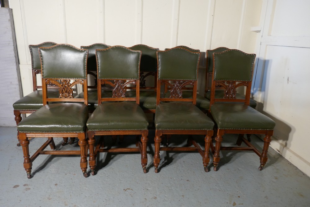 Set of 11 Arts and Crafts Golden Oak and Leather Dining Chairs   View II
