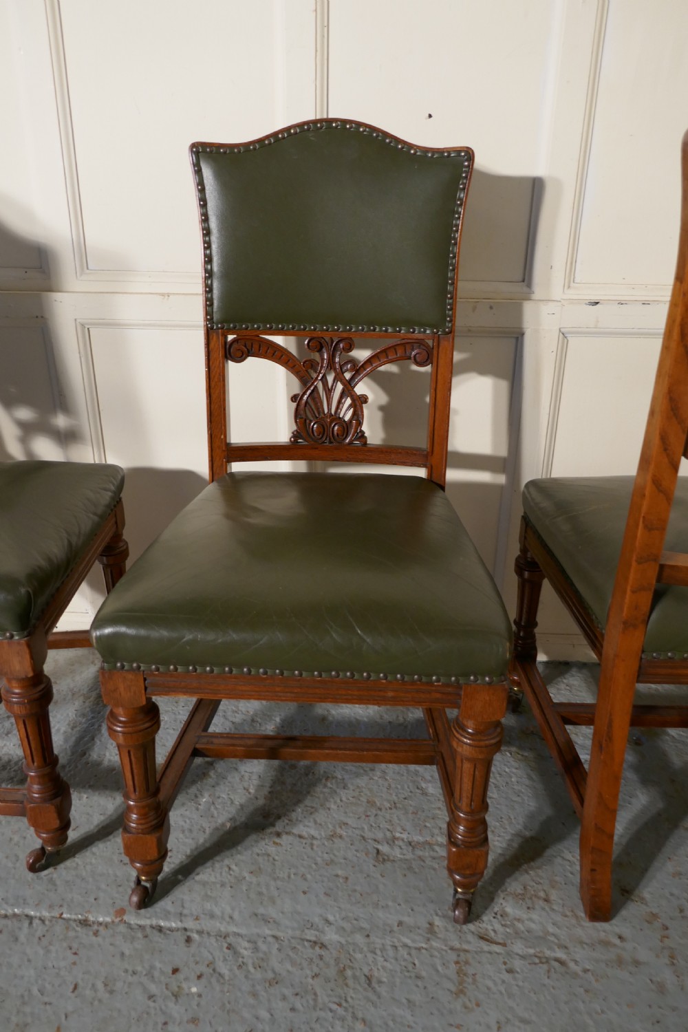 Set of 11 Arts and Crafts Golden Oak and Leather Dining Chairs   View IV