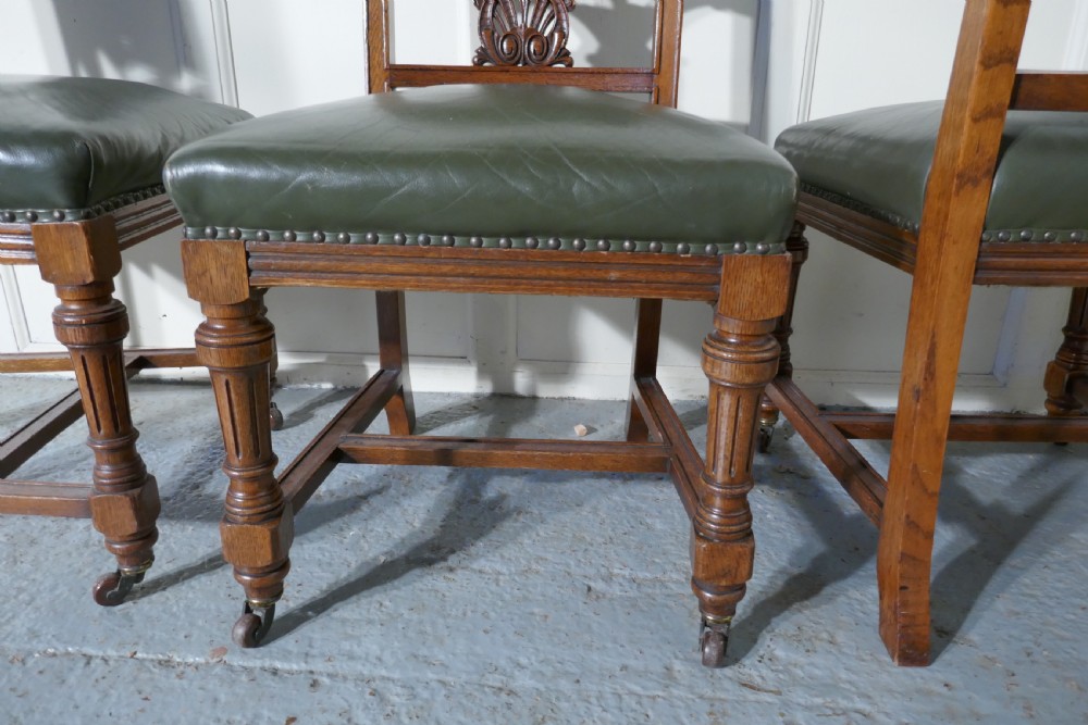 Set of 11 Arts and Crafts Golden Oak and Leather Dining Chairs   View V