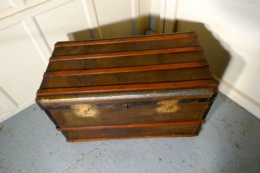 A Vintage Brass and Bound Canvas Travel Steamer Trunk View II