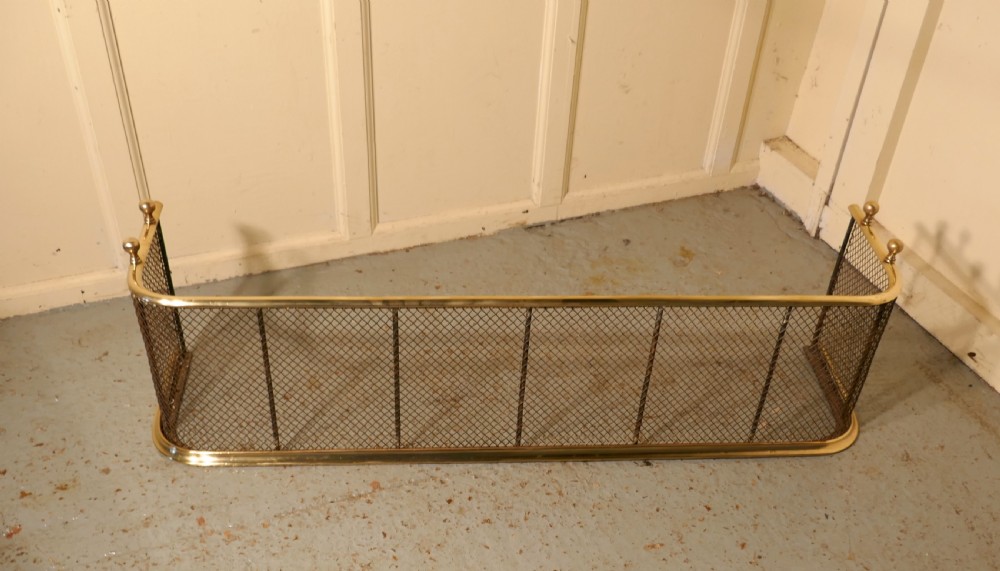 A Victorian Brass and Iron Fender or Fireguard View III