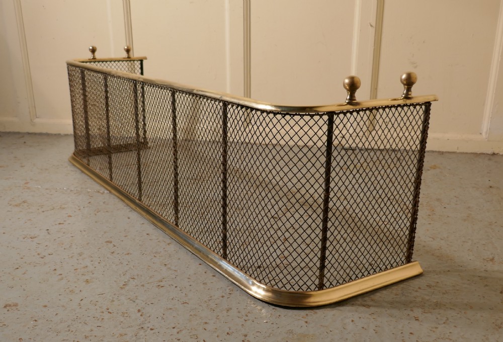 A Victorian Brass and Iron Fender or Fireguard View V