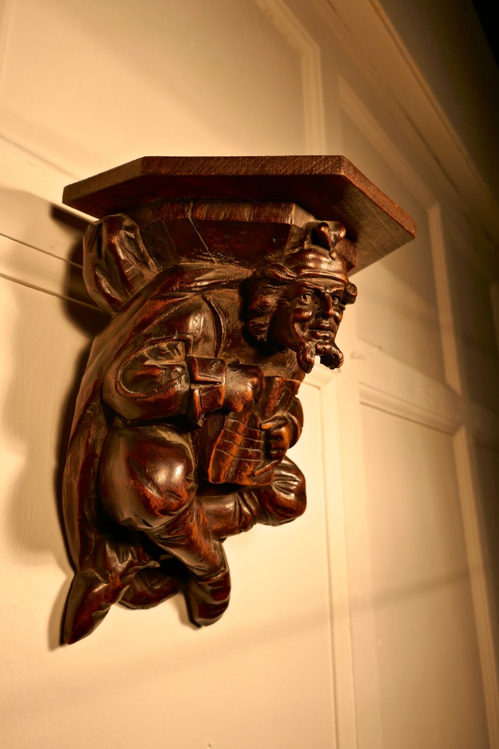 A 19th Century Carved Oak Wall Bracket, Medieval Magician 