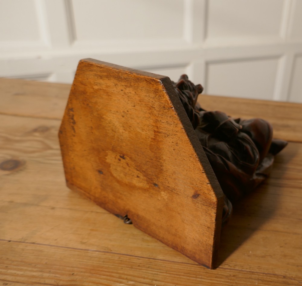 A 19th Century Carved Oak Wall Bracket, Medieval Magician  View IV