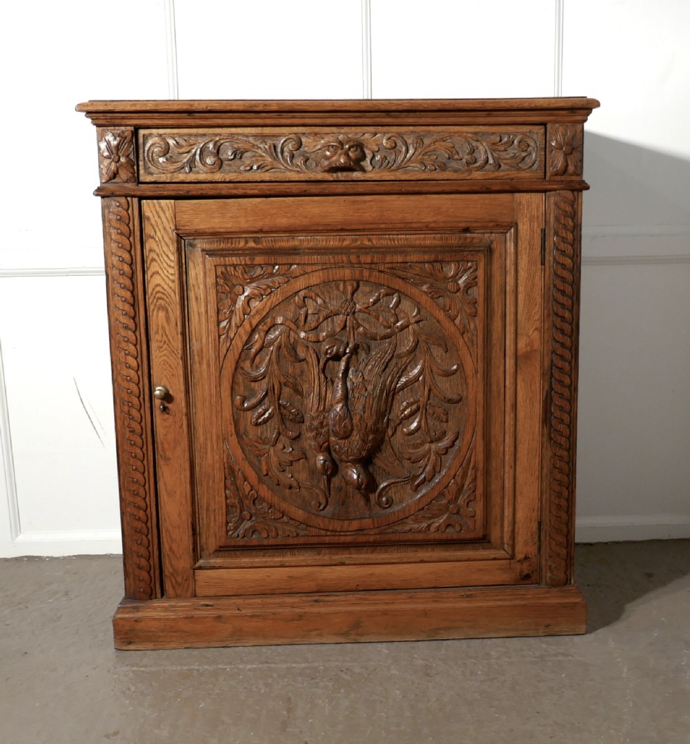 Carved Golden Oak Game Cupboard  