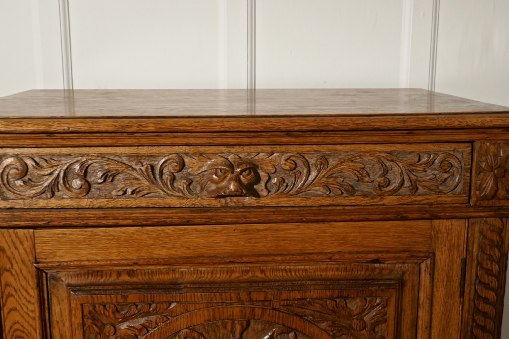 Carved Golden Oak Game Cupboard   View III