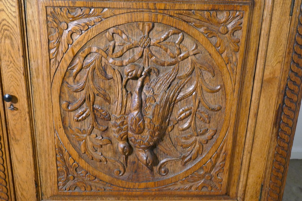 Carved Golden Oak Game Cupboard   View IV