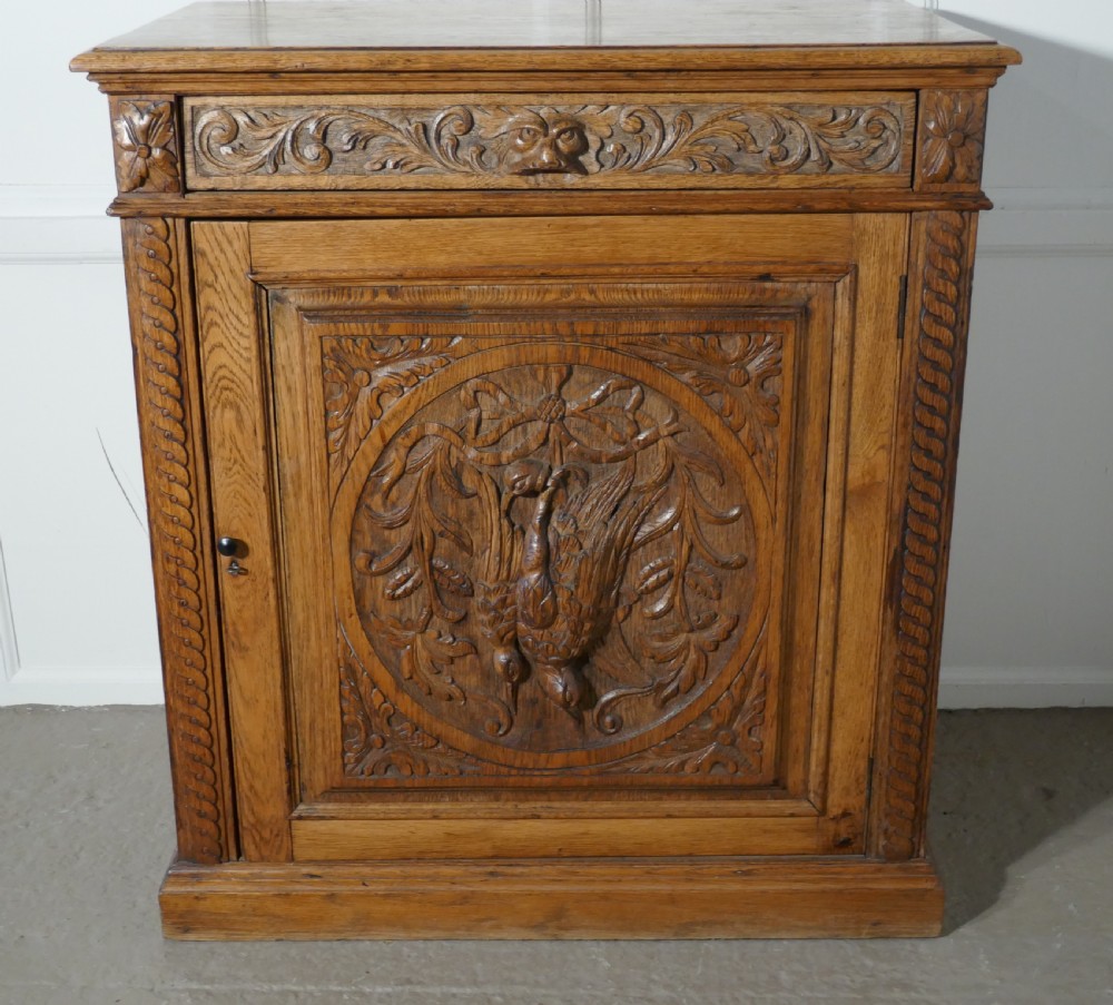 Carved Golden Oak Game Cupboard   View V