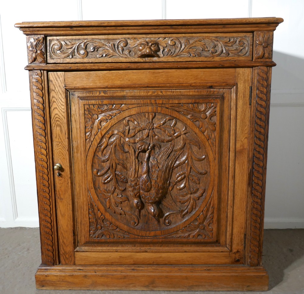 Carved Golden Oak Game Cupboard   View XII