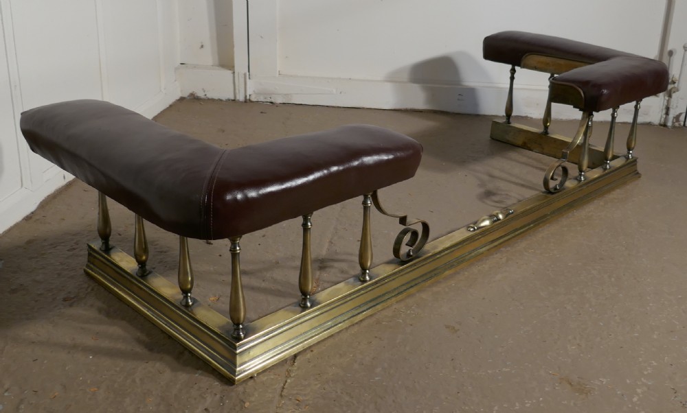 A Large Arts and Crafts Brass and Leather Club Fender View III
