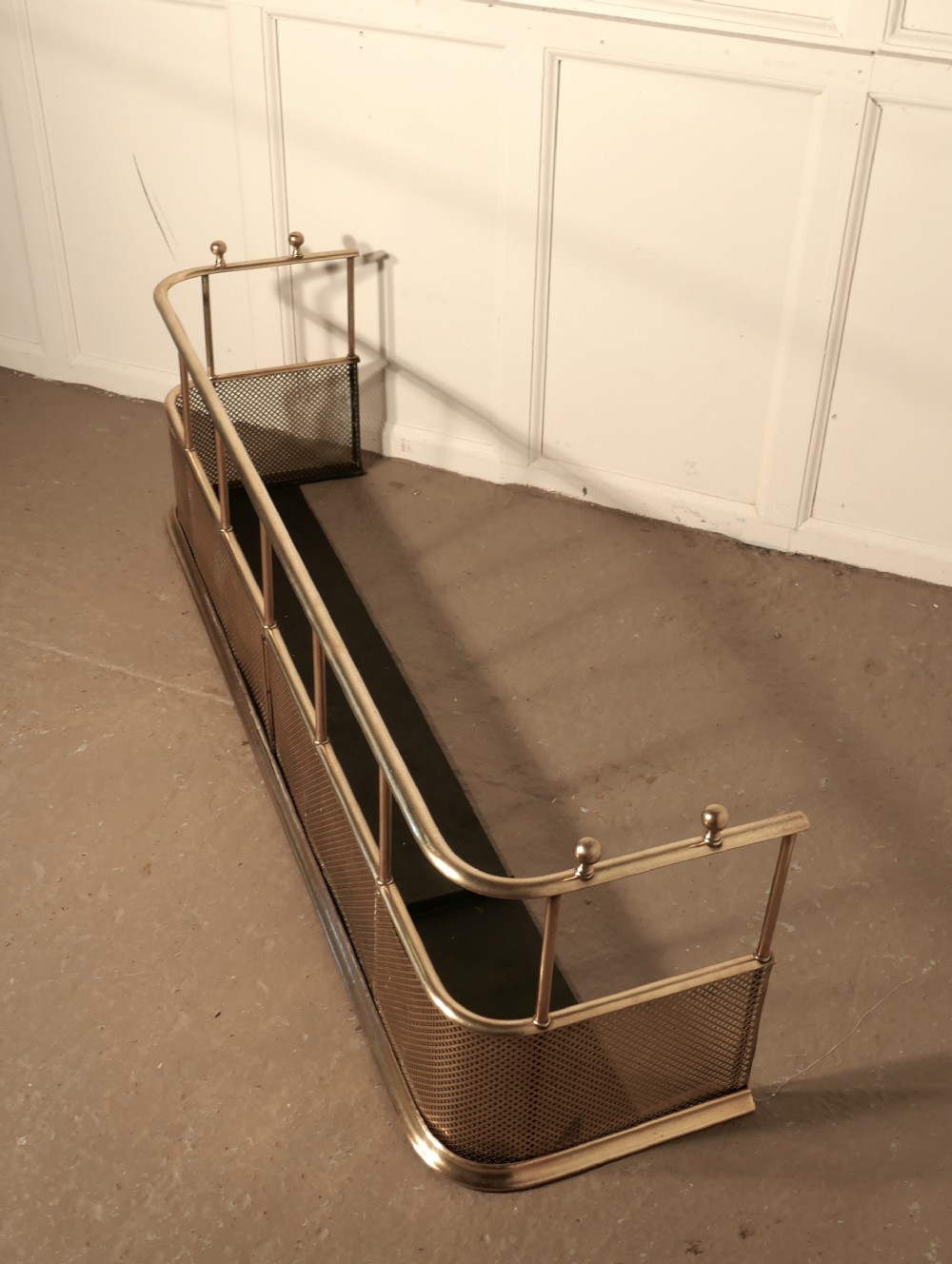 A Large Victorian Brass Club Fender 