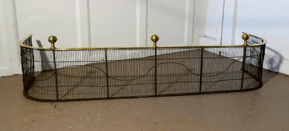 A Georgian Brass and Iron Club Fender View III