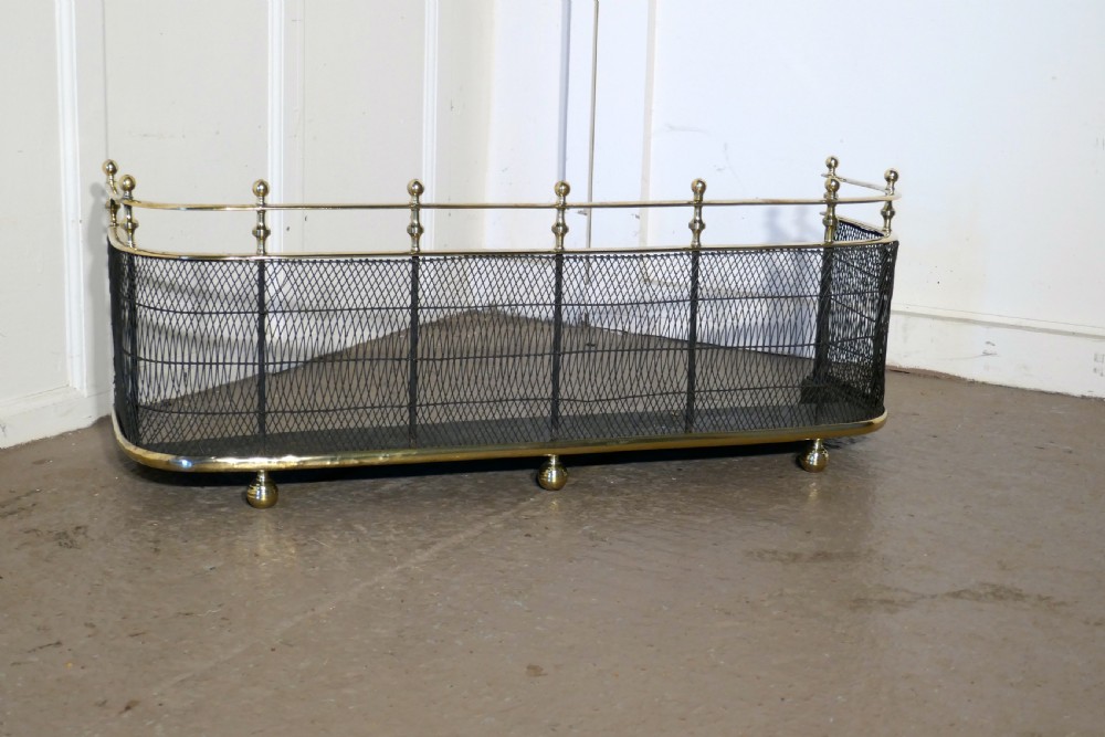 An Early Victorian Brass and Iron Fender or Fireguard View II