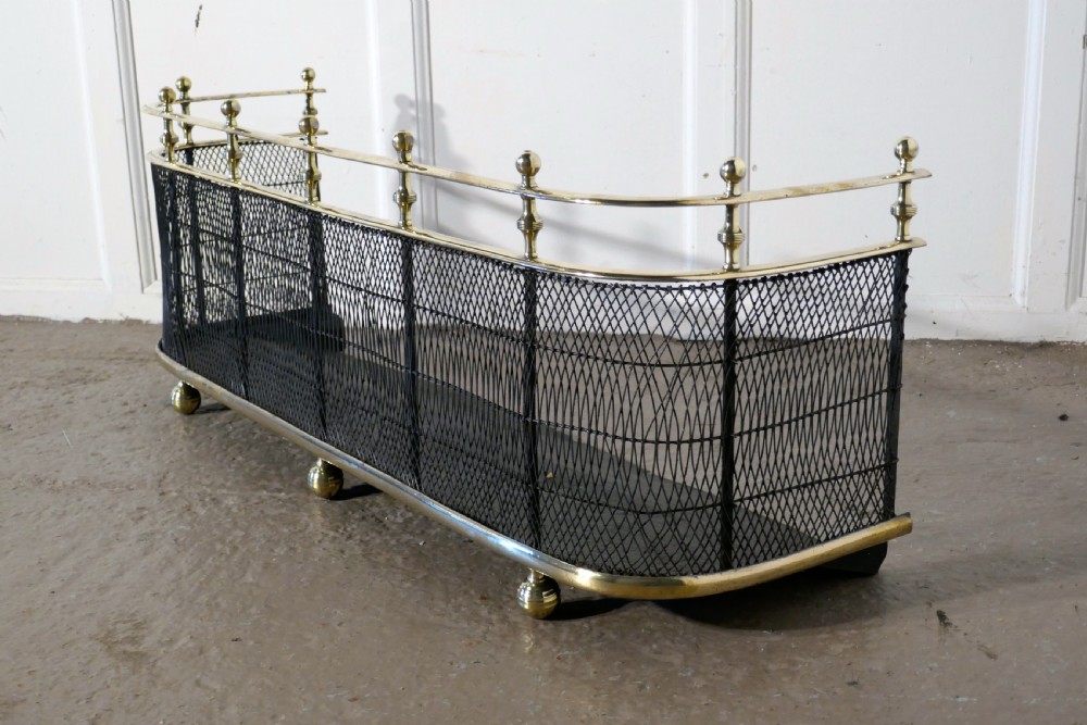 An Early Victorian Brass and Iron Fender or Fireguard View V