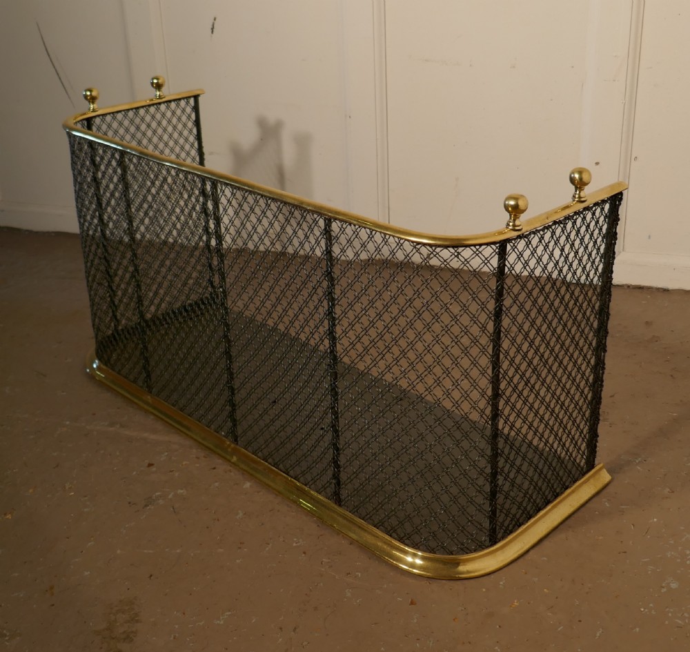 A Victorian Brass and Iron Fender or Fireguard View IV