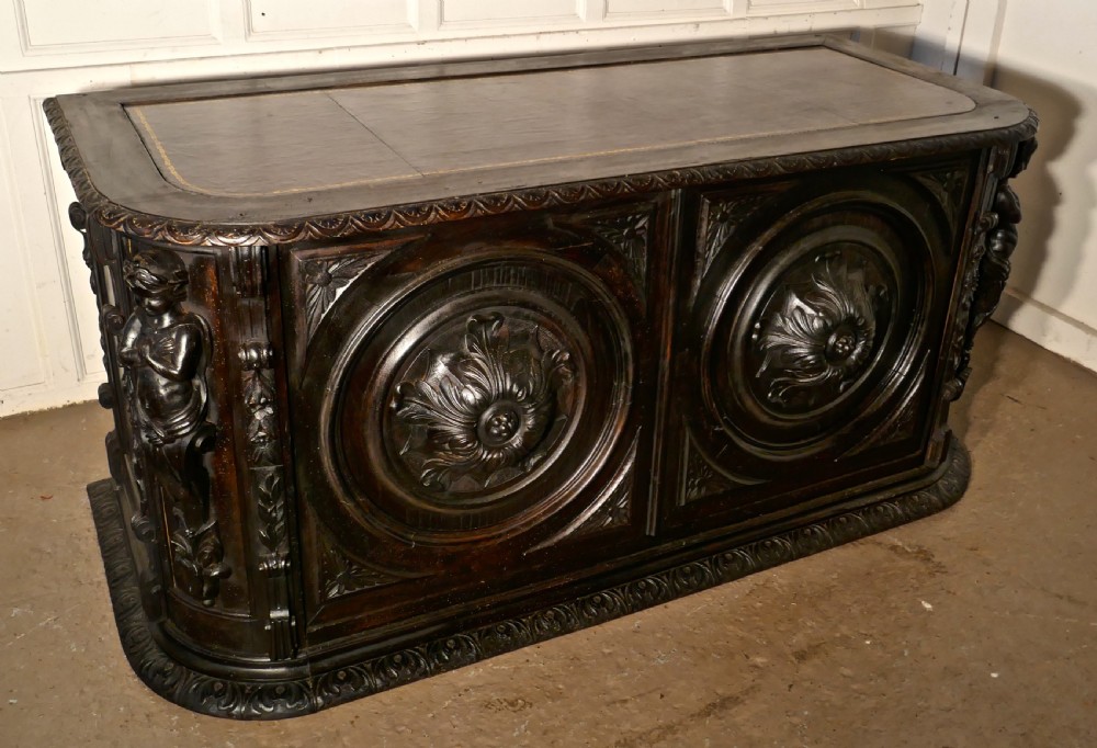19th Century French One Piece Oak Desk Carved with Cherubs