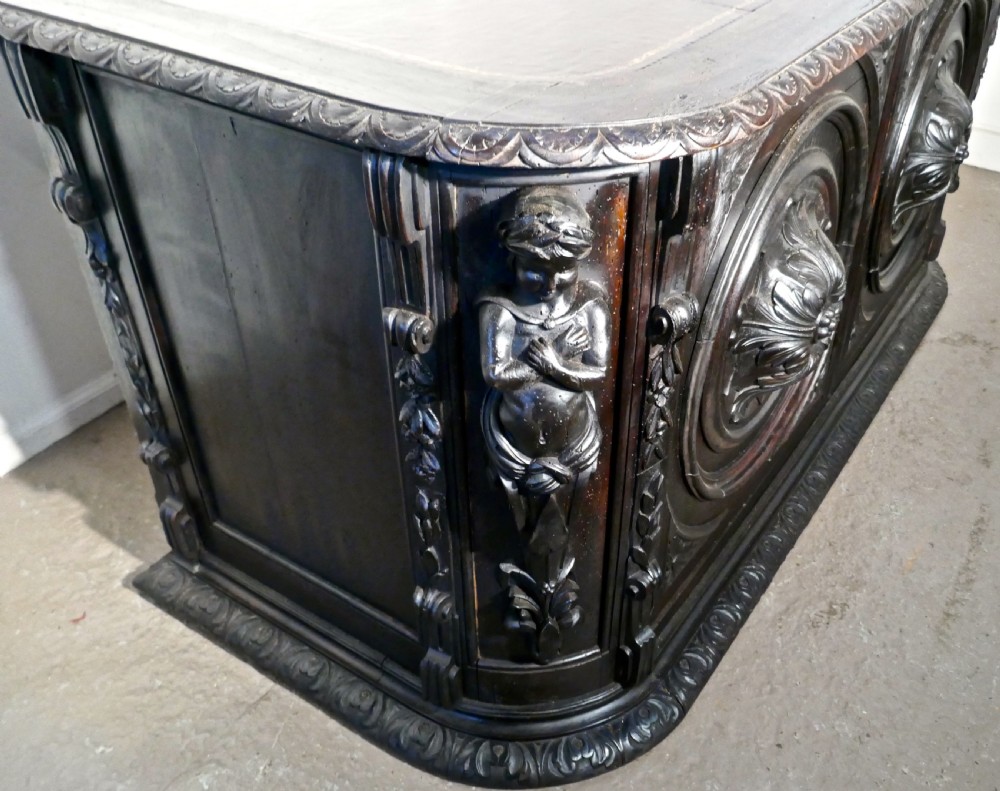 19th Century French One Piece Oak Desk Carved with Cherubs View X