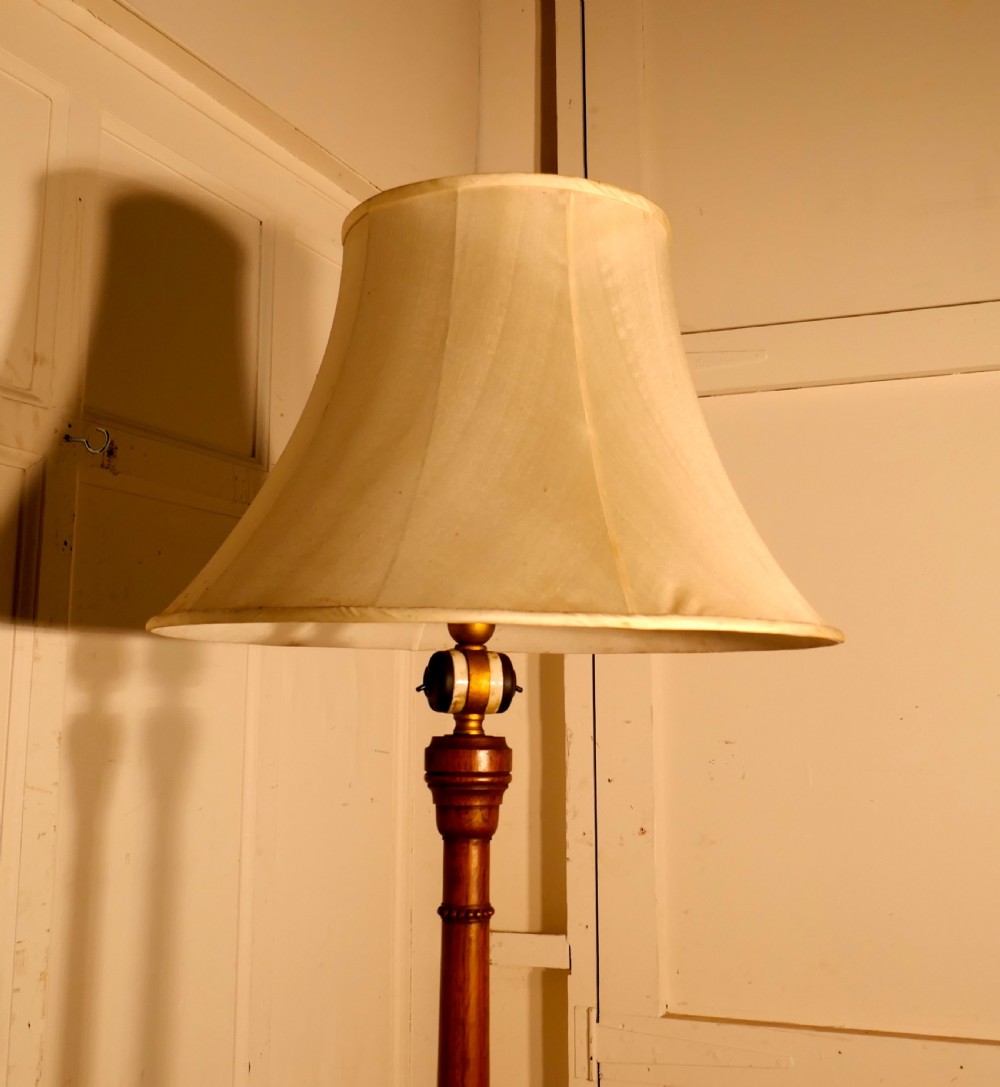 A Carved Blonde Mahogany Floor Standing Lamp View II