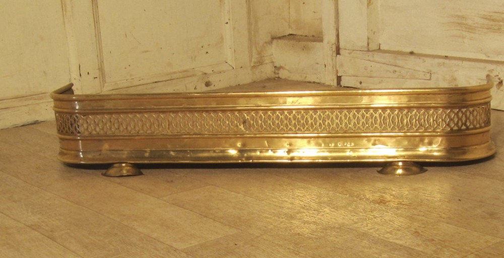 A Small Georgian Pierced Brass Fender