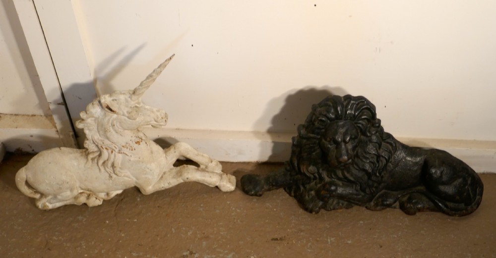 A pair of Flat Back Cast Iron Lion and Unicorn Garden Ornament Figures