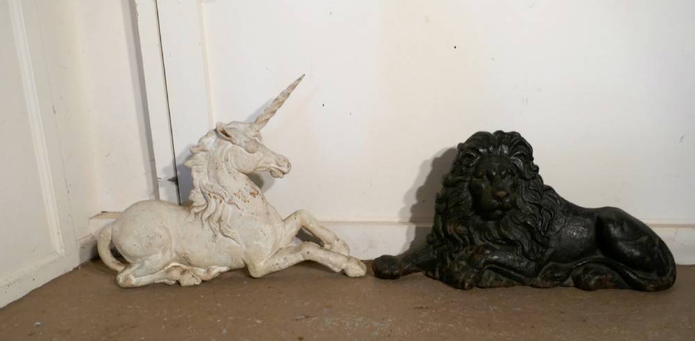 A pair of Flat Back Cast Iron Lion and Unicorn Garden Ornament Figures View II