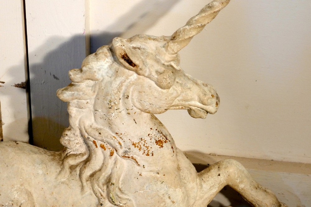 A pair of Flat Back Cast Iron Lion and Unicorn Garden Ornament Figures View III