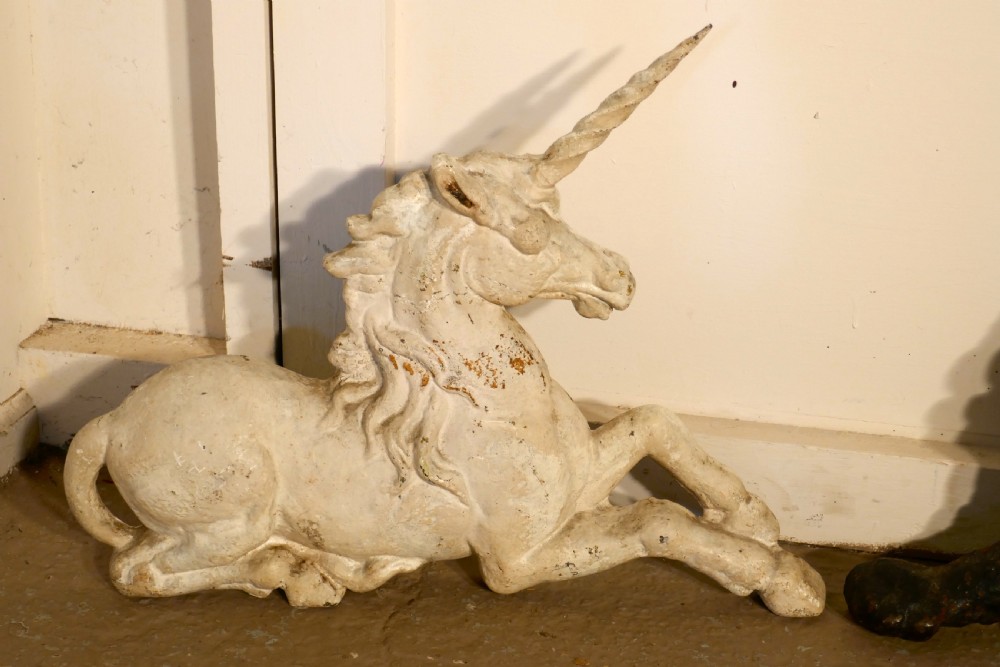 A pair of Flat Back Cast Iron Lion and Unicorn Garden Ornament Figures View IV