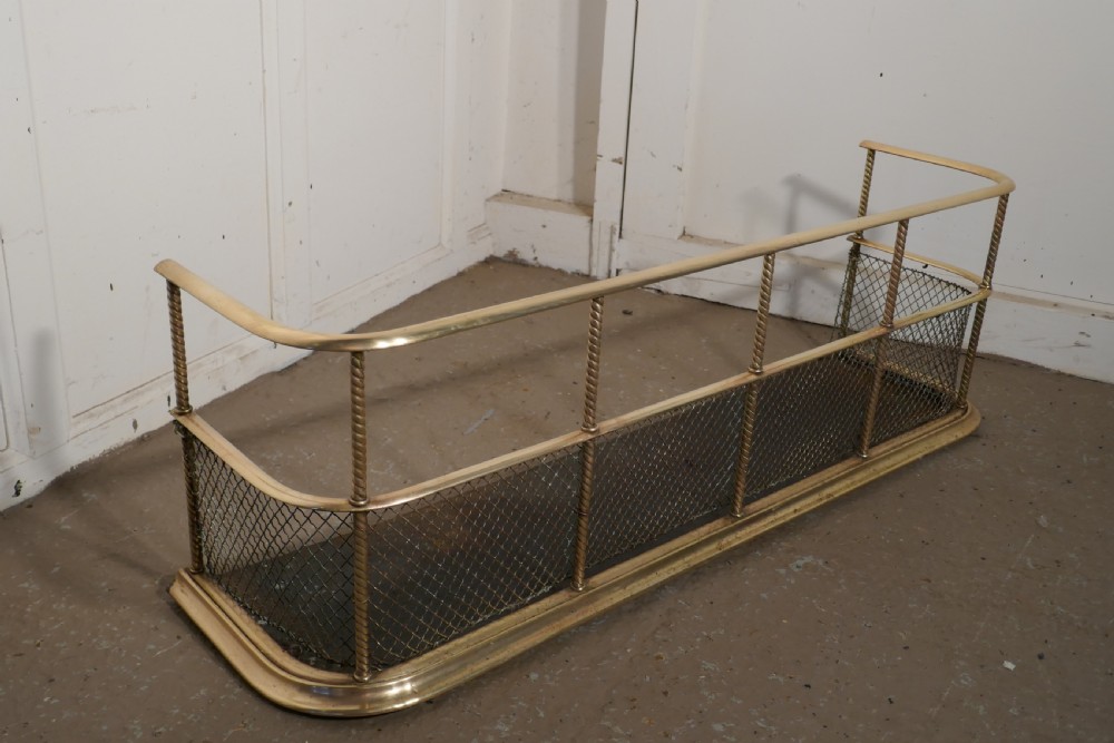 A Victorian Brass Club Fender  View II