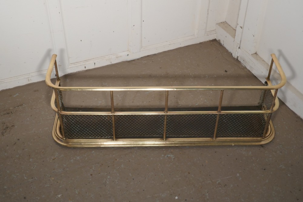 A Victorian Brass Club Fender  View IV
