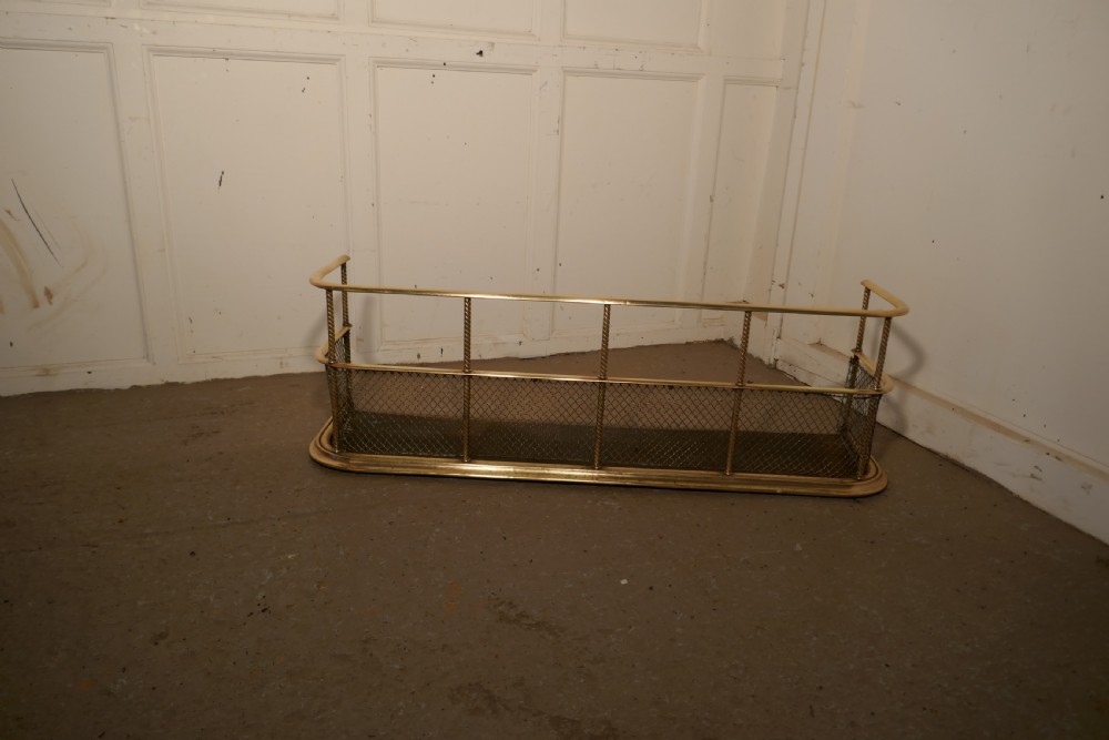 A Victorian Brass Club Fender  View V