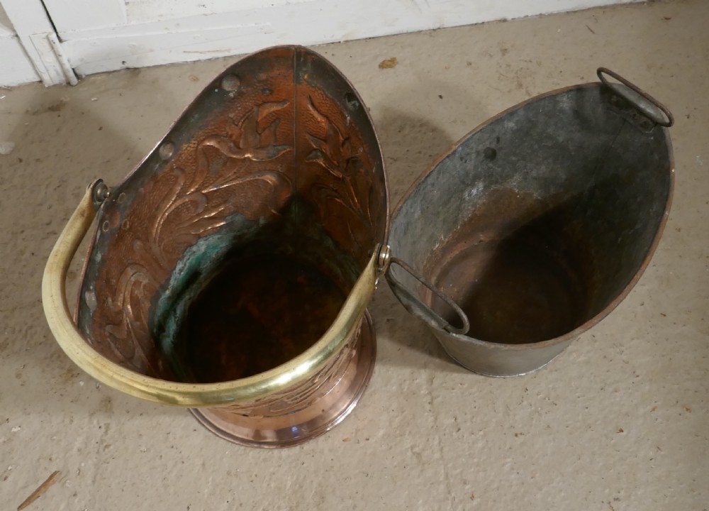 An Art Nouveau Embossed Copper Helmet Coal Scuttle with Liner View VI