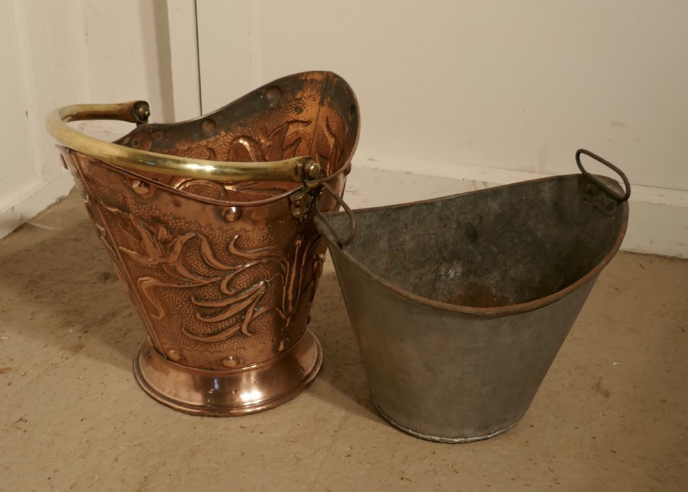 An Art Nouveau Embossed Copper Helmet Coal Scuttle with Liner View VII